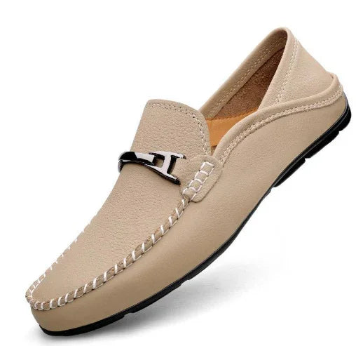 Beige men's leather moccasin loafer with black metal buckle and contrast white stitching