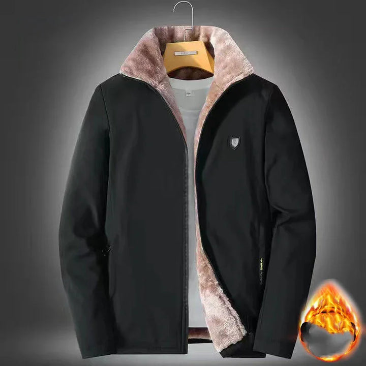 Black winter jacket with soft beige fur lining, displayed on a hanger with a fire icon indicating warmth