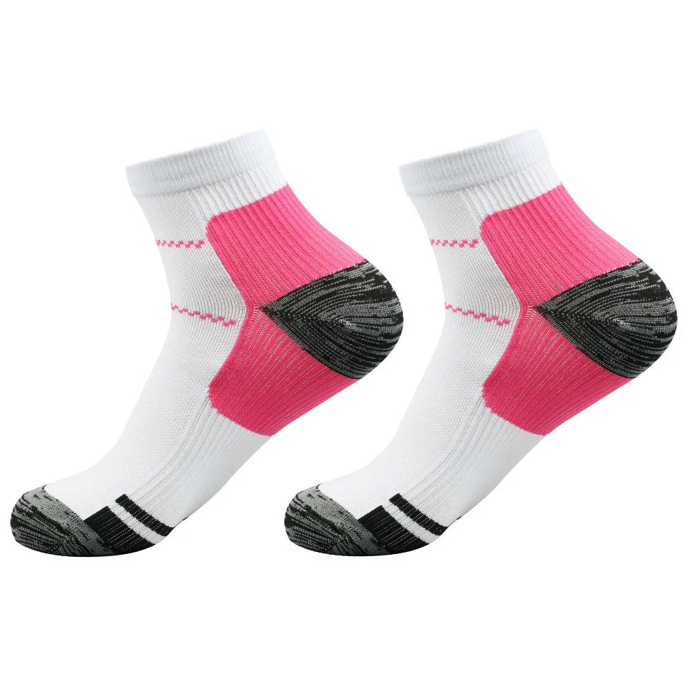 Pair of white ankle socks with pink heel support and black toe and sole accents