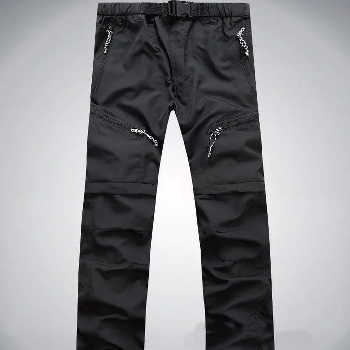 Black outdoor hiking pants with zipper pockets and adjustable belt on waist