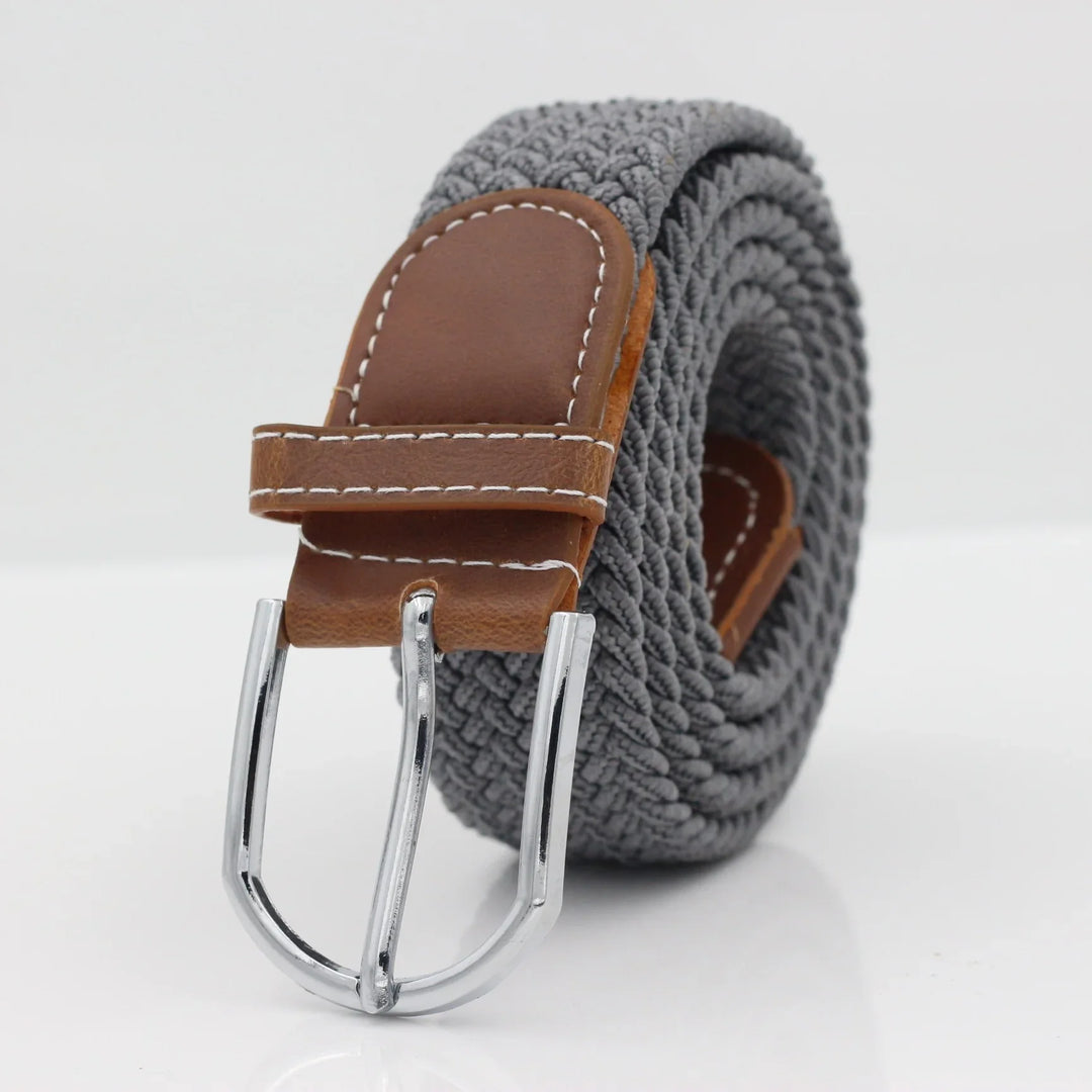 Grey woven fabric belt with brown leather buckle and silver metal clasp on white background