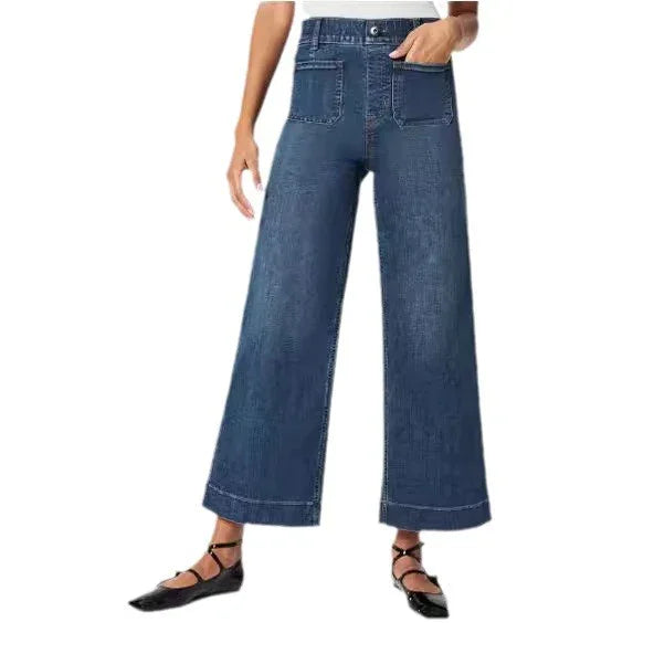 Wide-leg blue denim jeans with high waist and front patch pockets on a model