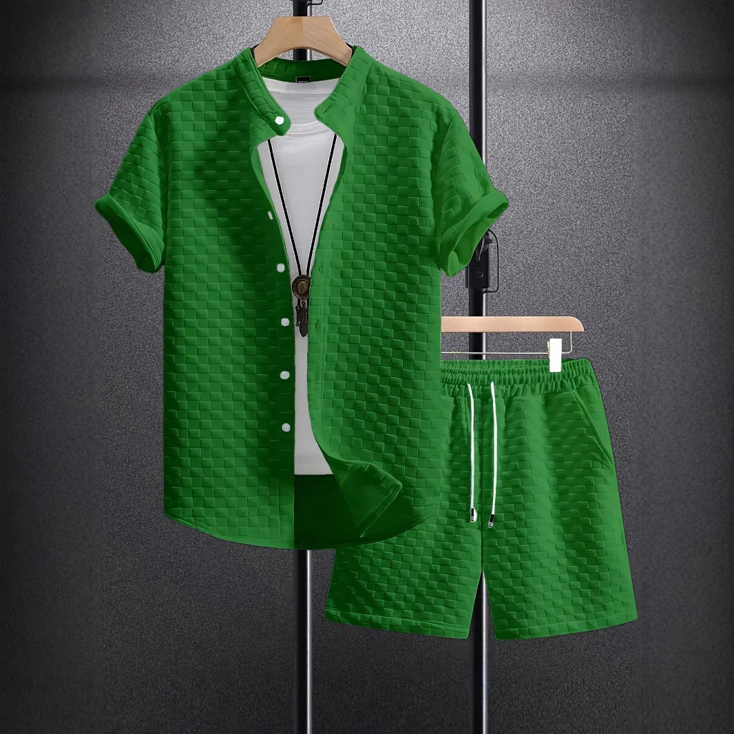 Green textured short-sleeve shirt with white buttons and matching shorts on hangers