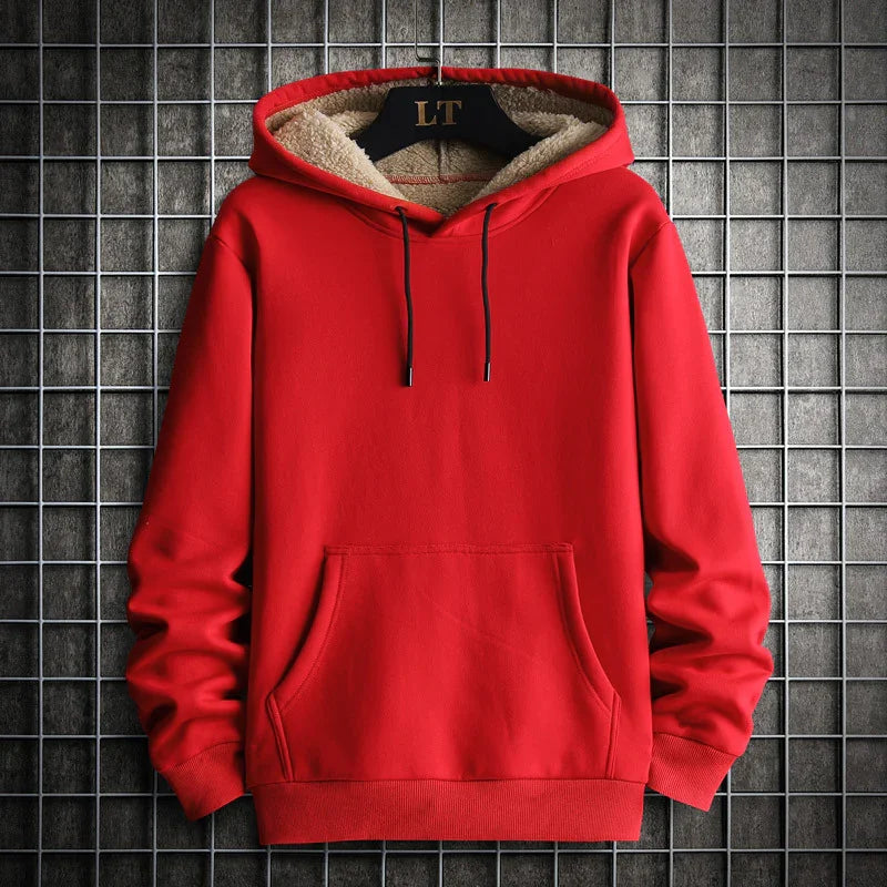 Red fleece-lined hoodie with front pocket and black drawstrings on grid background