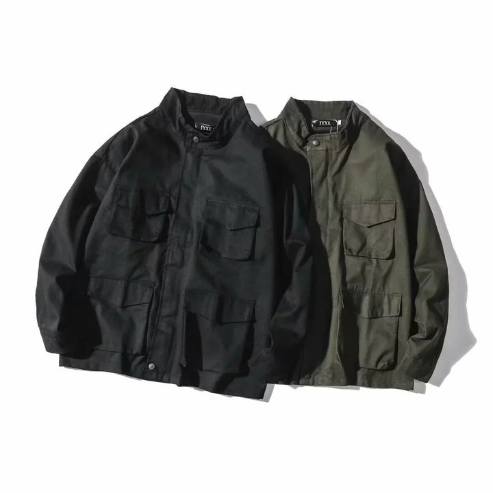 Black and olive green utility jackets with stand collars and multiple front pockets on white background