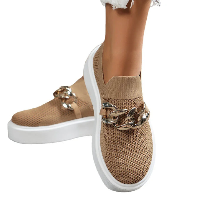 Beige knit slip-on sneakers with white sole and decorative gold chain detail