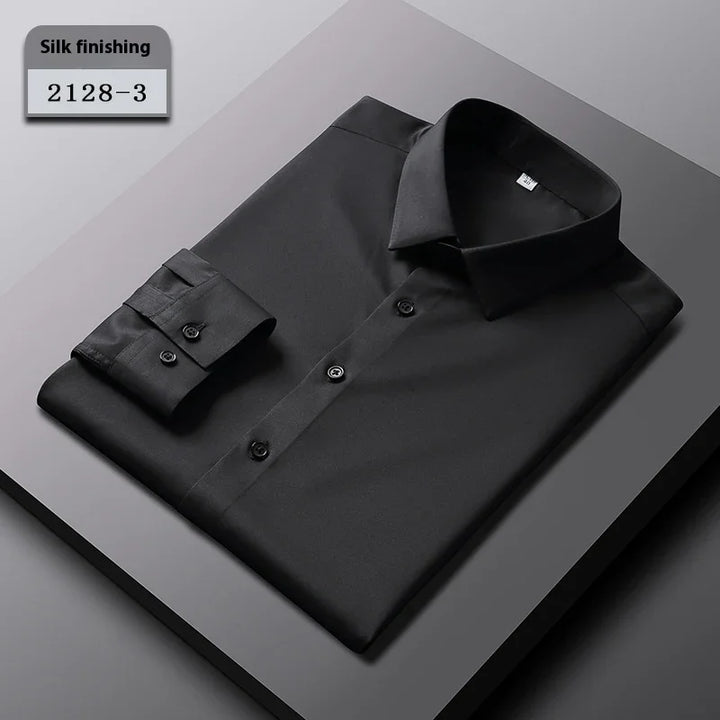 Black silk finishing dress shirt folded on dark surface with label 2128-3