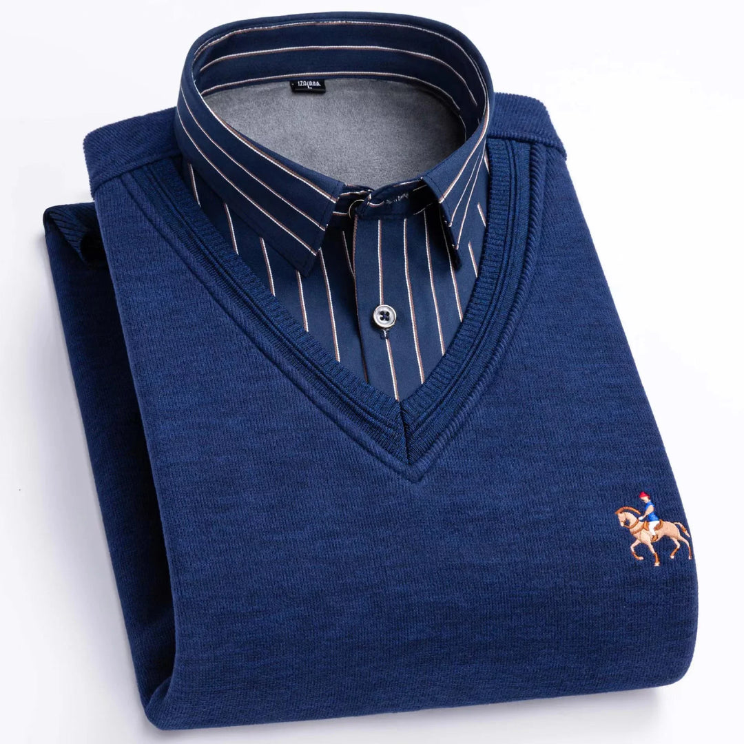 Folded navy blue V-neck sweater over striped navy button-down shirt with embroidered horse rider logo