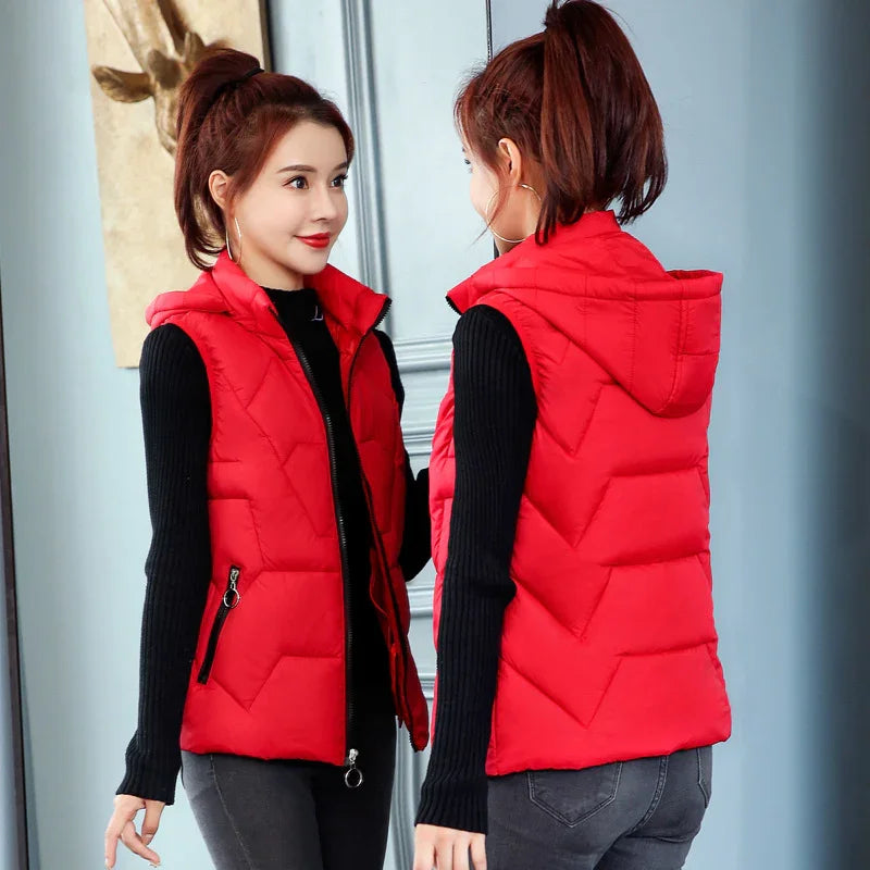 Woman wearing red quilted hooded vest and black sweater, shown front and back view indoors