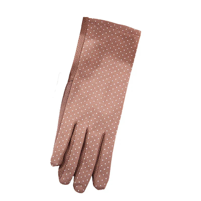 Single brown glove with white polka dots on a white background, women's fashion accessory