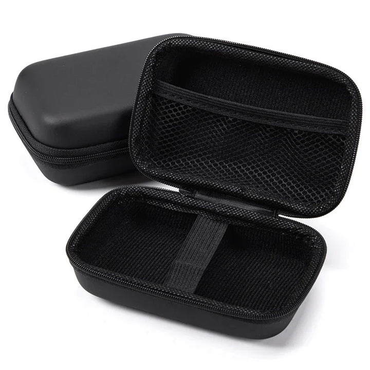 Black hard shell zippered carrying case with mesh pocket and elastic strap, open and empty