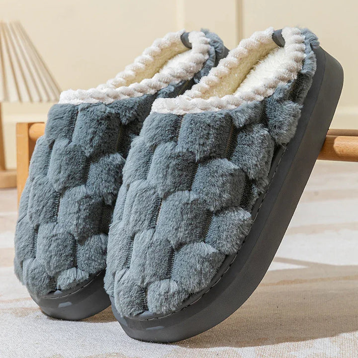 Cozy gray plush indoor slippers with white fleece lining and textured cushioned soles