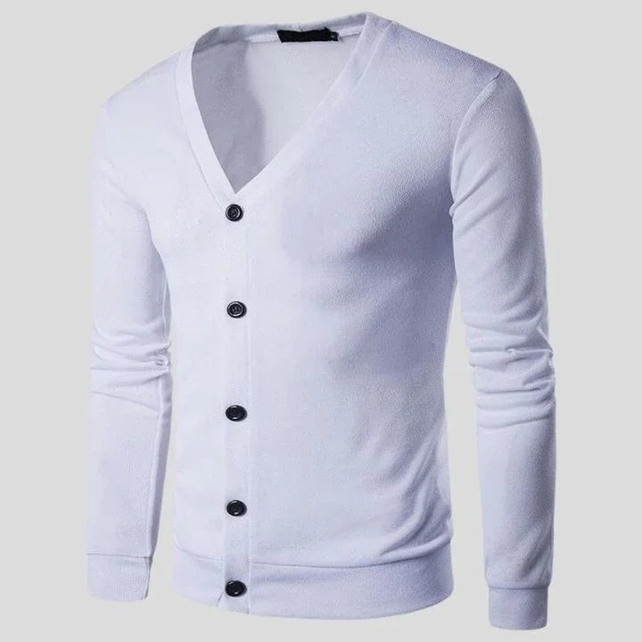 White long-sleeve V-neck cardigan with black buttons on a plain background