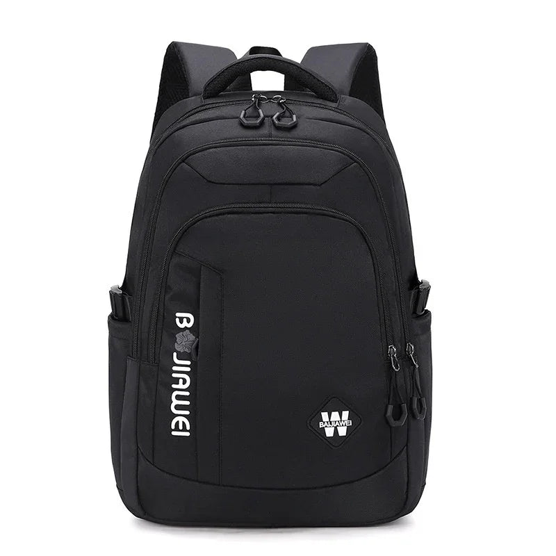 Black waterproof backpack with multiple zippered compartments and padded shoulder straps