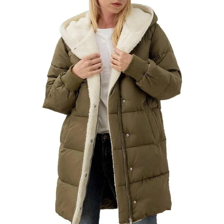 Woman wearing olive green puffer coat with white sherpa lining and hood
