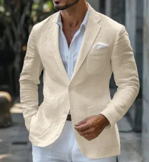 Man wearing a beige linen blazer with white shirt and pocket square outdoors