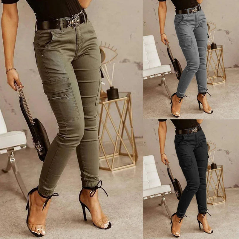 Women wearing high-waisted cargo pants in olive, gray, and black paired with black heels and black tops indoors