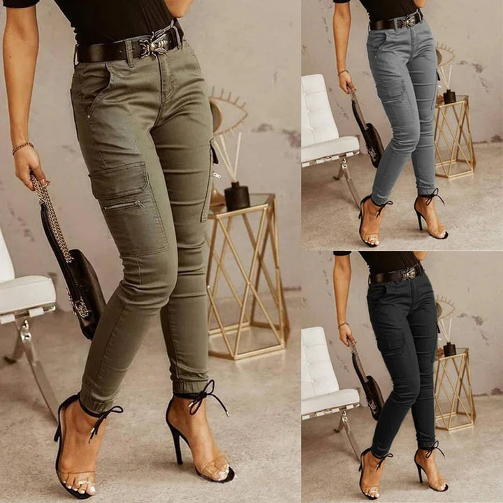 Women wearing high-waisted cargo pants in olive, gray, and black paired with black heels and black tops indoors