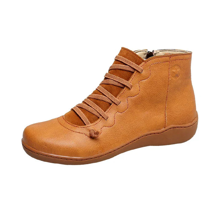Casual tan leather ankle boot with unique wavy lace-up design and flat sole