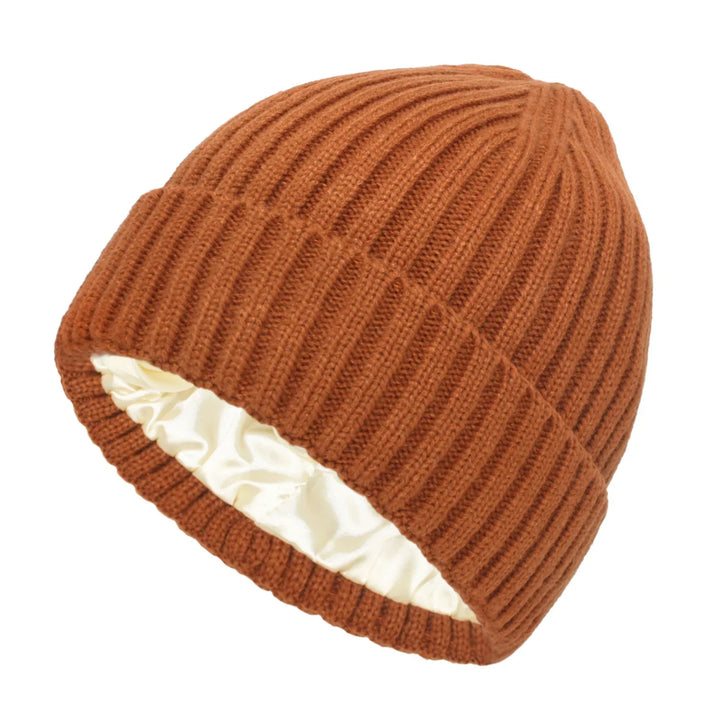 Rust-colored ribbed knit beanie with white satin lining, winter hat for warmth