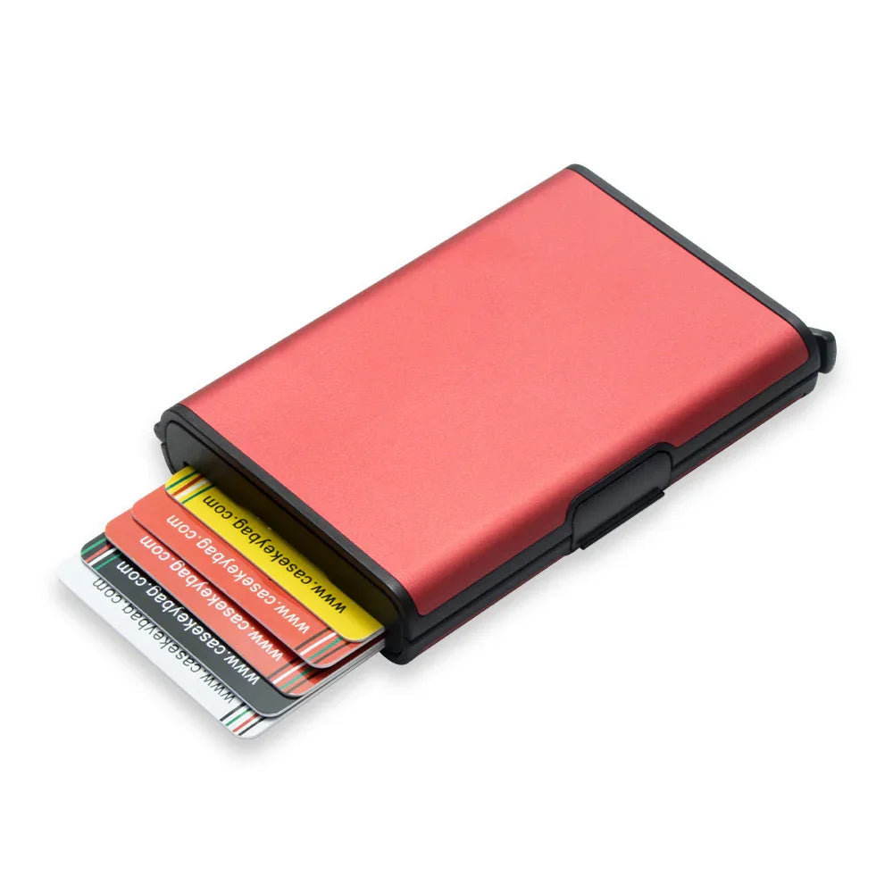 Red slim card holder wallet partially open with multiple colorful cards inside on white background