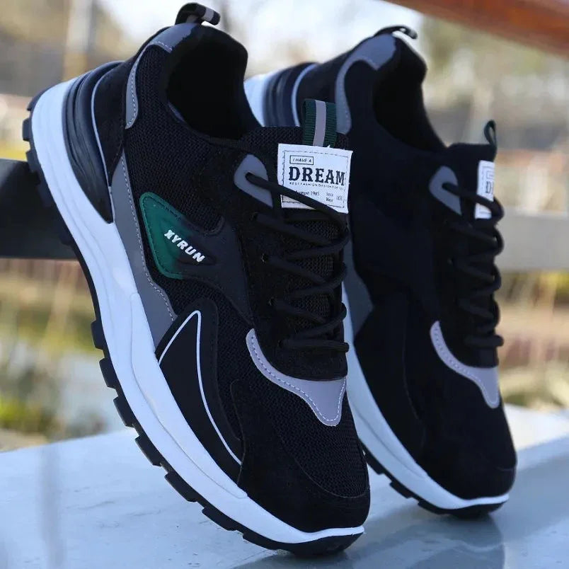 Black and gray XYRUN sneakers with white soles and 'DREAM' label on tongue, casual running shoes