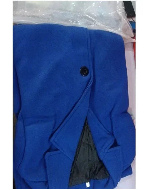 Folded blue wool coat with black button and inner black lining on surface