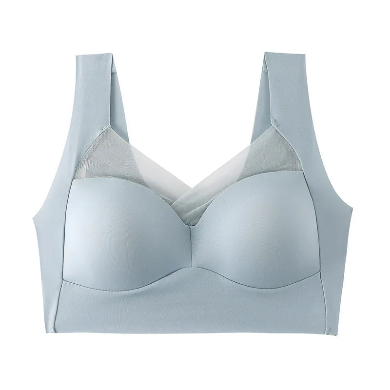 Light blue wireless bra with wide straps and breathable mesh panel, seamless design