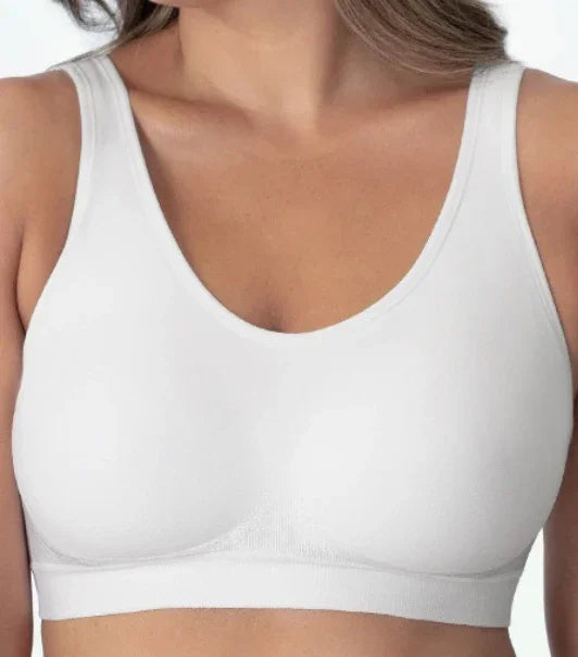 Close-up of woman wearing seamless white wireless bra with wide straps