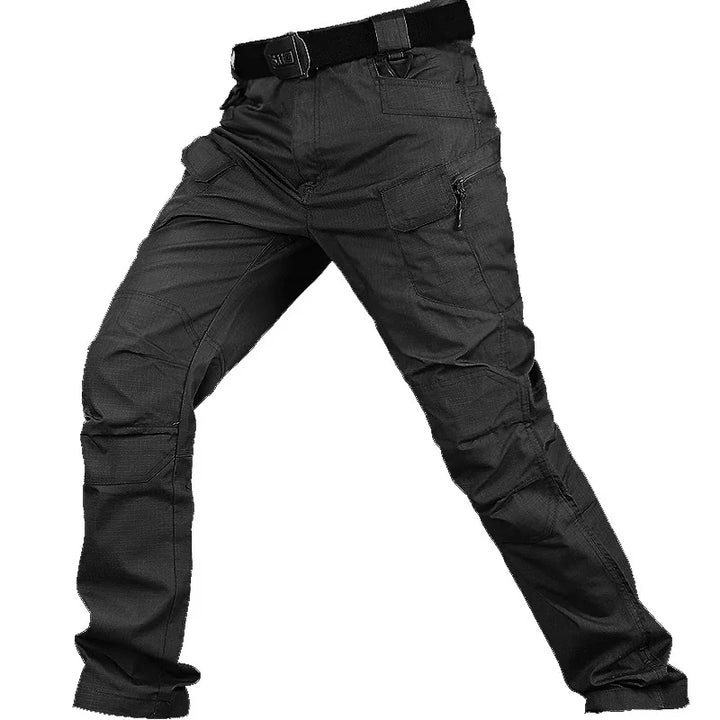 Black tactical cargo pants with multiple pockets and a black belt on a model