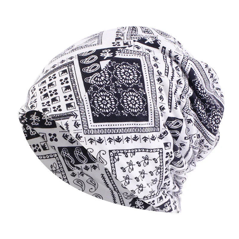 Black and white patterned slouchy beanie hat with floral and geometric designs