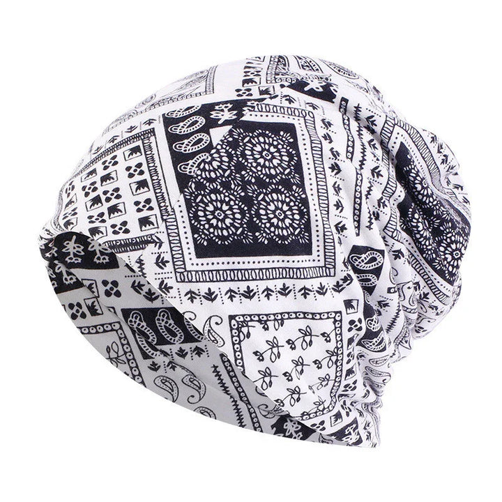 Black and white patterned slouchy beanie hat with floral and geometric designs