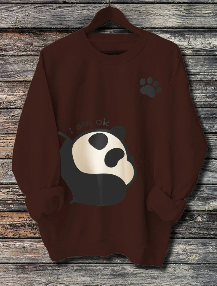 brown sweatshirt with a cute panda graphic and paw print, text says 'i am ok', displayed on wooden background