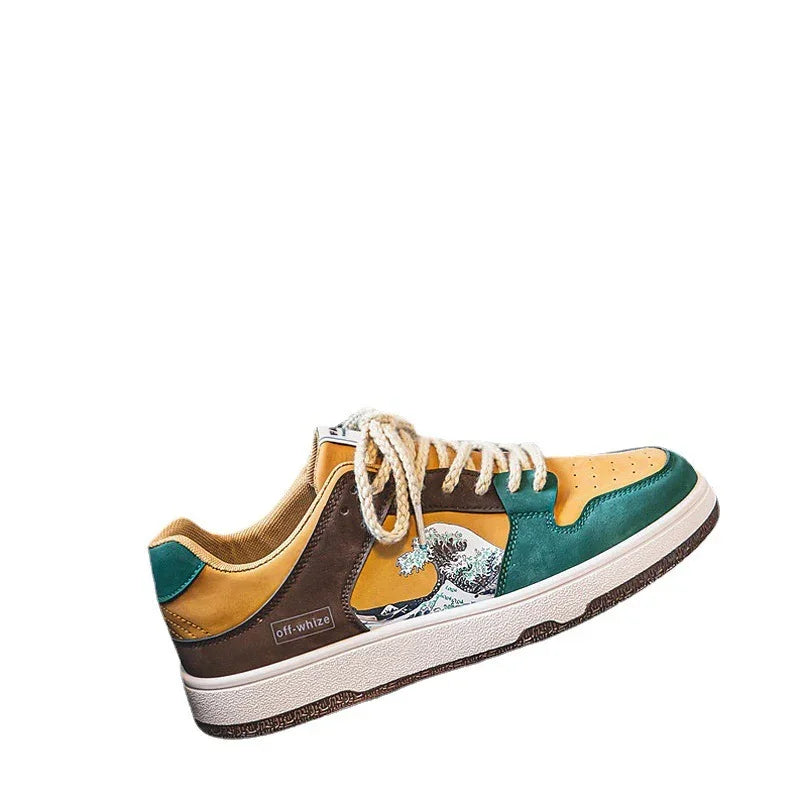 Colorful sneaker shoe with teal, yellow, and brown panels and white laces on white background