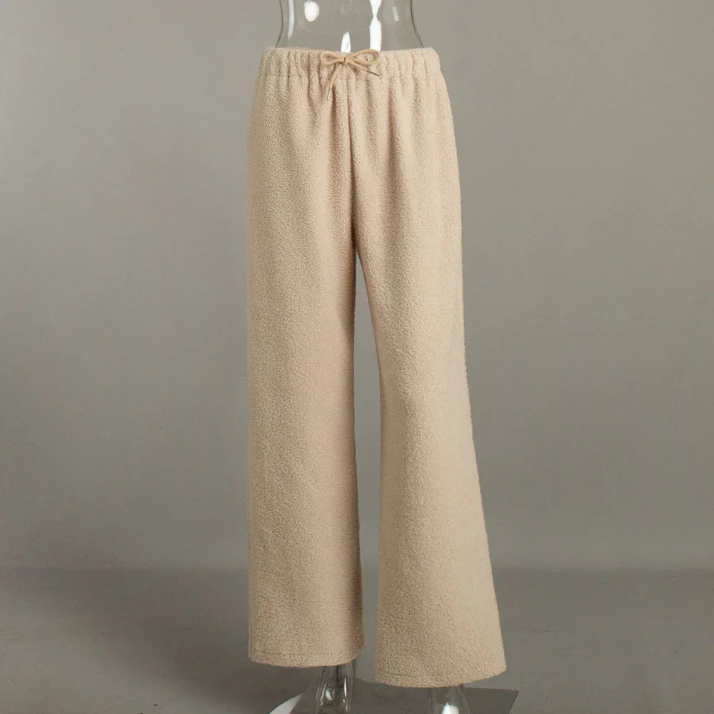 Beige fuzzy wide-leg lounge pants with drawstring waistband on transparent mannequin