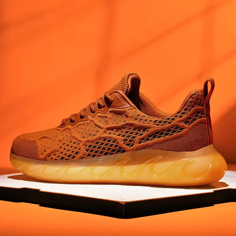 brown knitted athletic sneaker with thick translucent sole on white platform against orange background