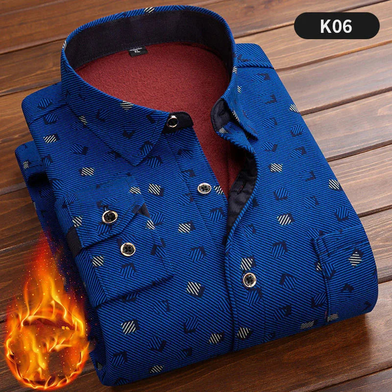 Folded blue patterned men's warm flannel shirt with buttoned cuffs on wooden surface