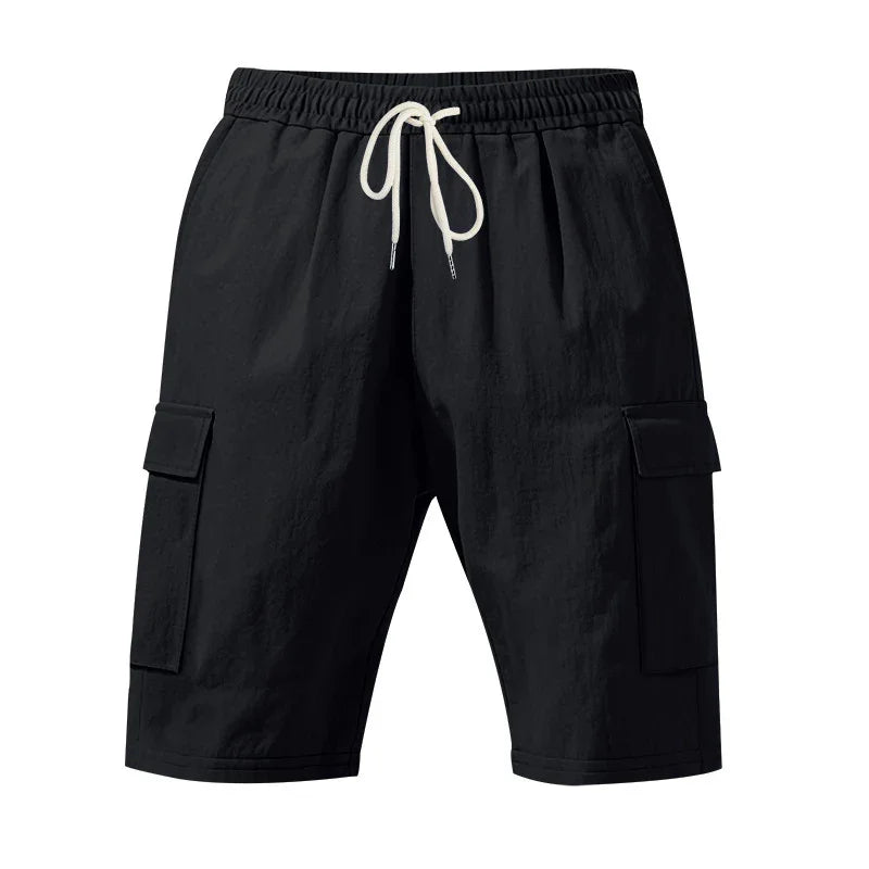 Black cargo shorts with white drawstring, elastic waistband, and side flap pockets