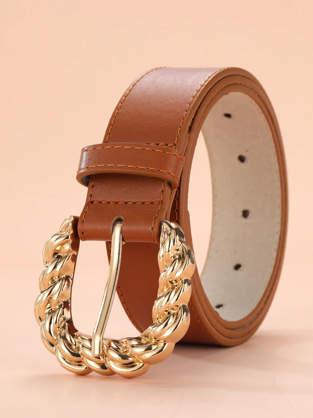 Tan leather belt with large twisted gold buckle and stitched edges