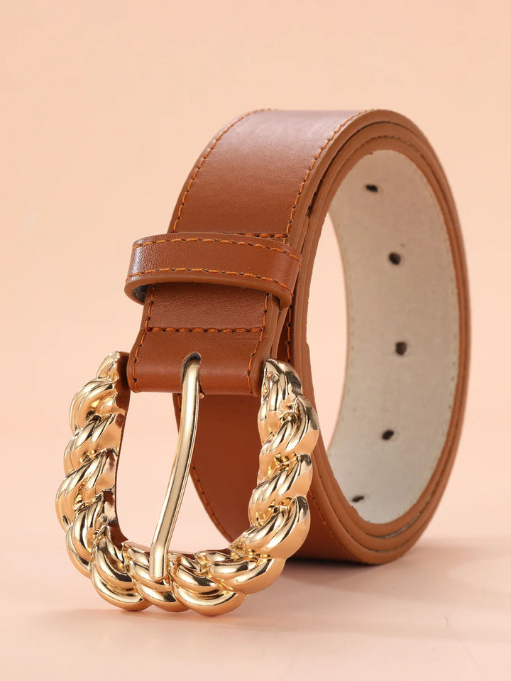 Tan leather belt with large twisted gold buckle and stitched edges
