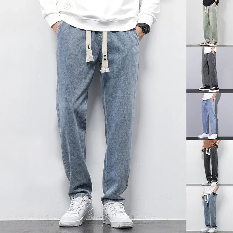 Men's casual denim jogger pants with drawstring waist in multiple colors, styled with white sneakers