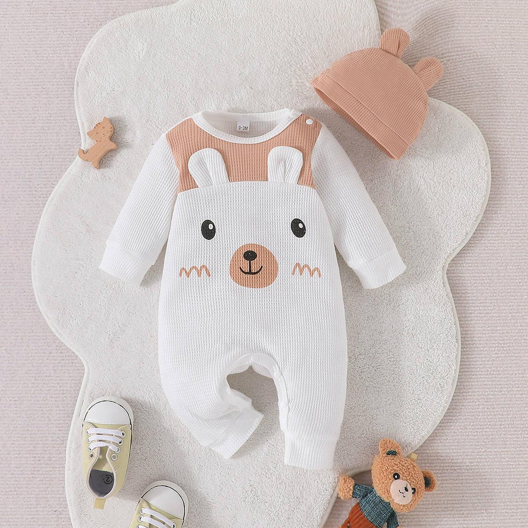 Cute baby onesie with bear face design, matching hat with bear ears, baby shoes, and teddy bear toy