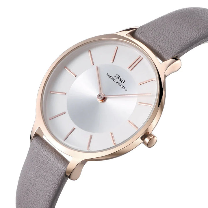 Minimalist IBSO wristwatch with rose gold case, white dial, and gray leather strap