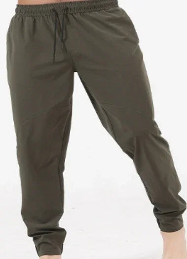 olive green jogger pants with elastic waistband and cuffs on white background