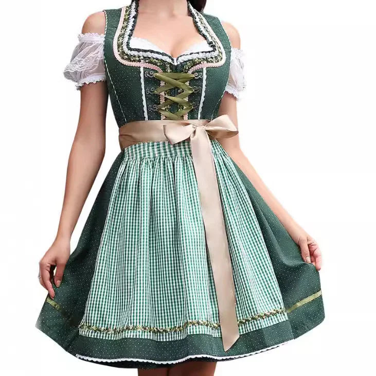 Green traditional Bavarian dirndl dress with white lace blouse and beige apron bow