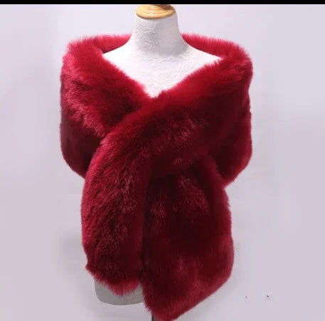 Luxurious deep red faux fur stole wrapped around a white mannequin torso
