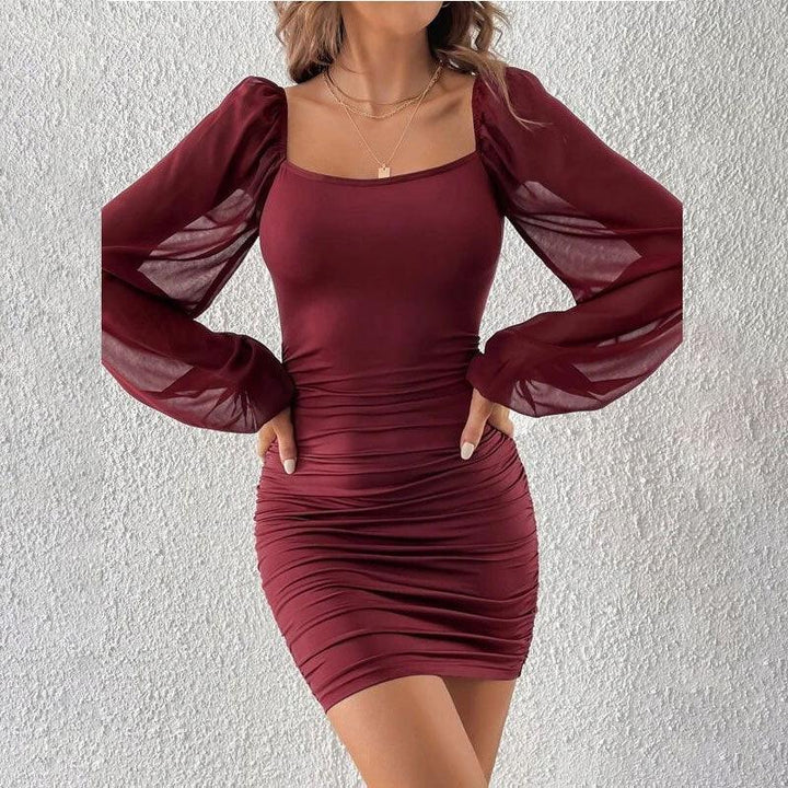 Woman wearing burgundy ruched bodycon mini dress with sheer puff long sleeves and square neckline