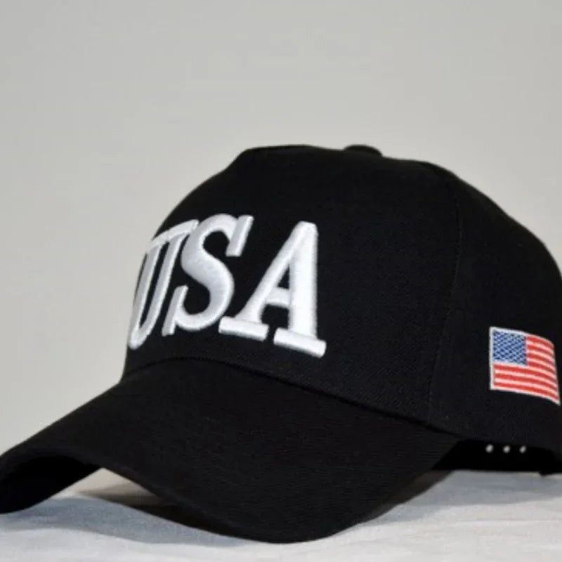 Black baseball cap with large white USA letters on front and American flag patch on side