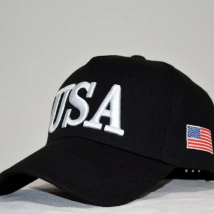 Black baseball cap with large white USA letters on front and American flag patch on side