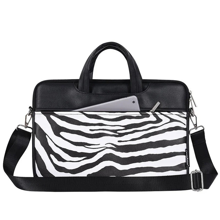 Black and white zebra print laptop bag with handles, adjustable shoulder strap, and tablet in front pocket